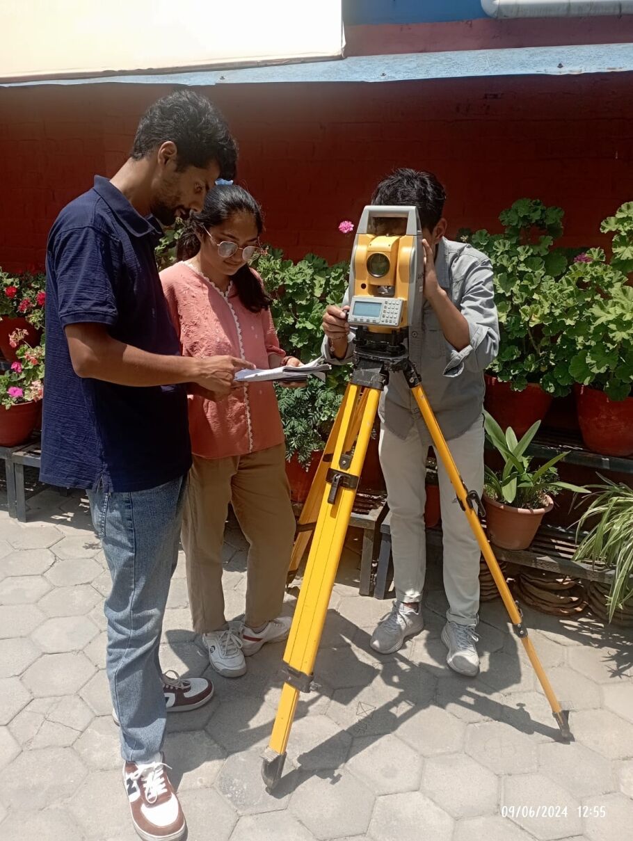 Students participating in the Survey Competition demonstrating field measurement techniques